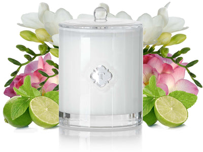 TEMPLE WILD FREESIA & LIME CANDLE with delicately blended fragrance notes of wild freesia, kaffir lime with just the slightest hint of lavender, undertones of neroli and warm amber combine to create a beautifully rejuvenating summer scent, in our exclusive white faceted glass.